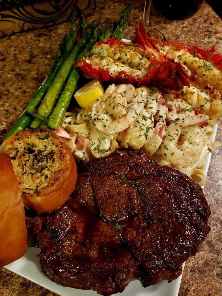 Shrimp pasta,grilled lobster with garlic butter, Ribeye seasoned simply