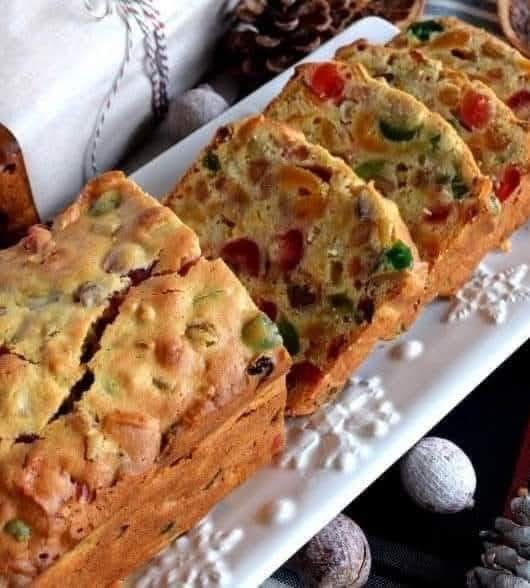 festive fruitcake, rich with colorful candied fruits and nuts.