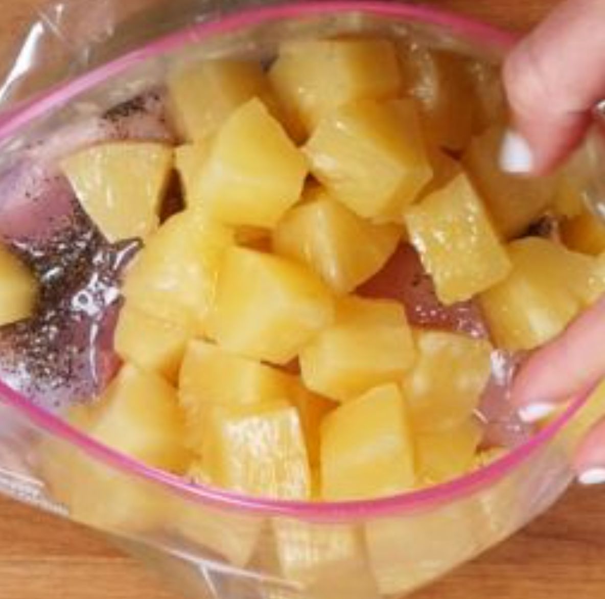 Shake up pineapple and chicken in bag. Prepare for a scrumptious slow cooker feast