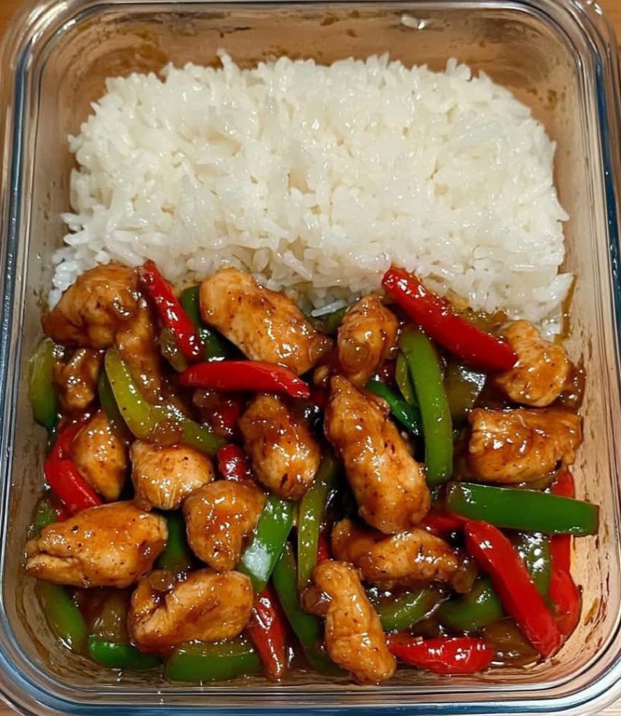 Sizzling garlic chicken stir fry with peppers and steamed rice