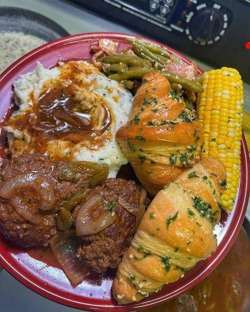 Salisbury steak with garlic mashed potatoes and mushroom & onion gravy