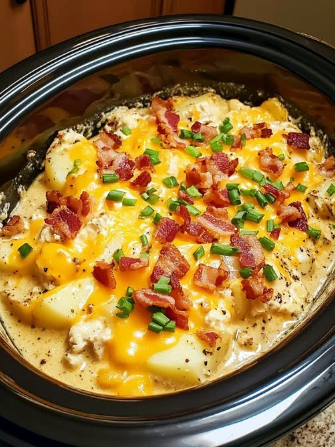 reamy, cheesy, and loaded with bacon, this Crock Pot Crack Potato Soup
