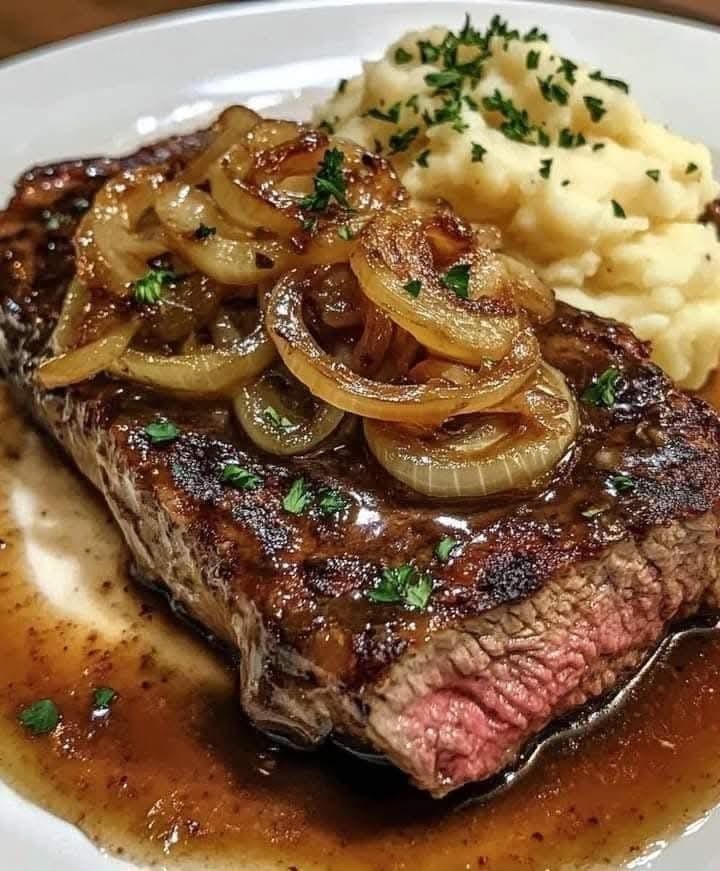 Ribeye Steak with Caramelized Onions and Mashed Potatoes – the ultimate comfort dinner!